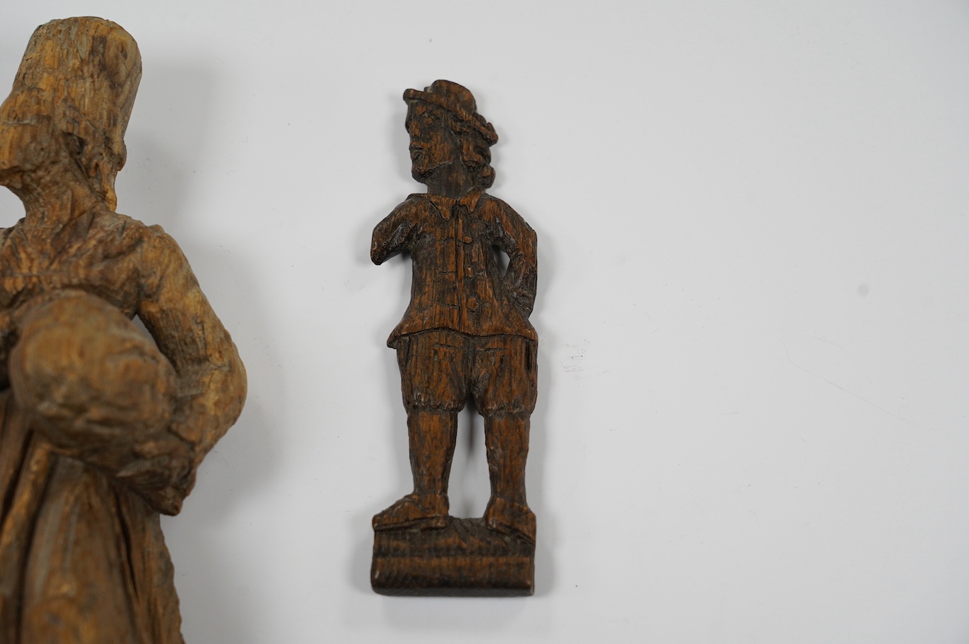 Two 17th century or earlier, European carved oak figures, tallest 20cm high. Condition - fair considering age